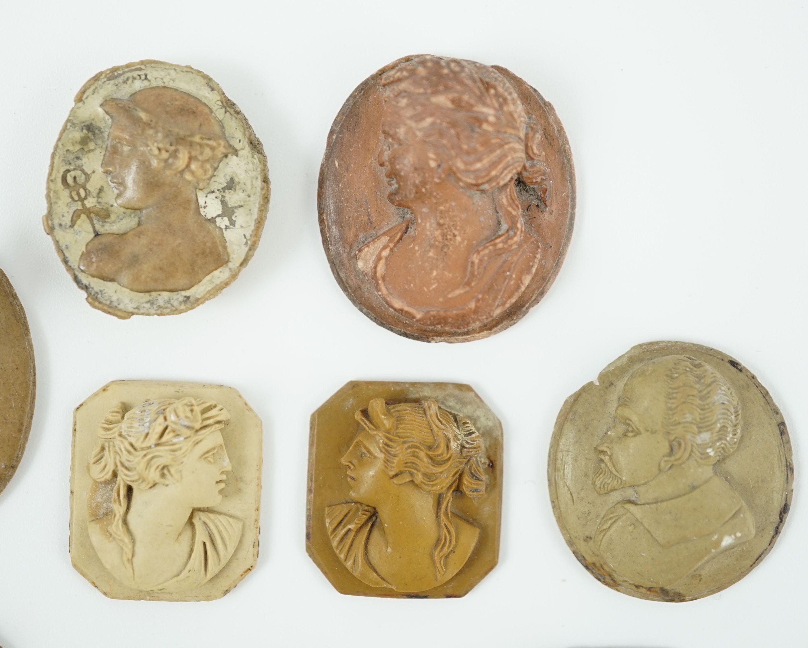 An antique hardstone cameo of Hermes and nine Italian lava cameos largest 2.75 x 2.25cm.